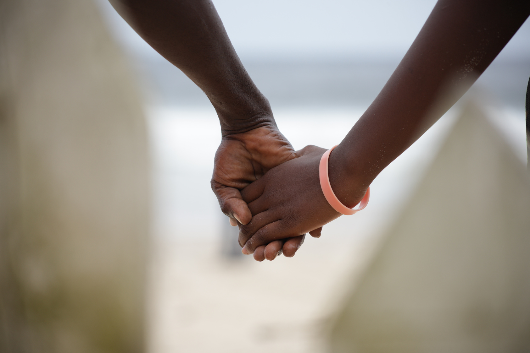 Black couple holding hands